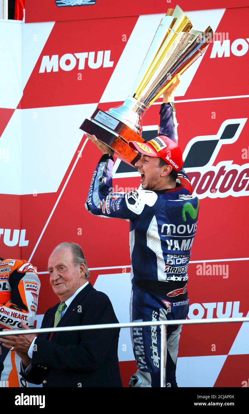 Spanish New World Champion Yamaha Motogp Rider Jorge Lorenzo Holds His Trophy Next To Spanish Former King Juan Carlos After Winning The Race During The Valencia Motorcycle Grand Prix At The Ricardo