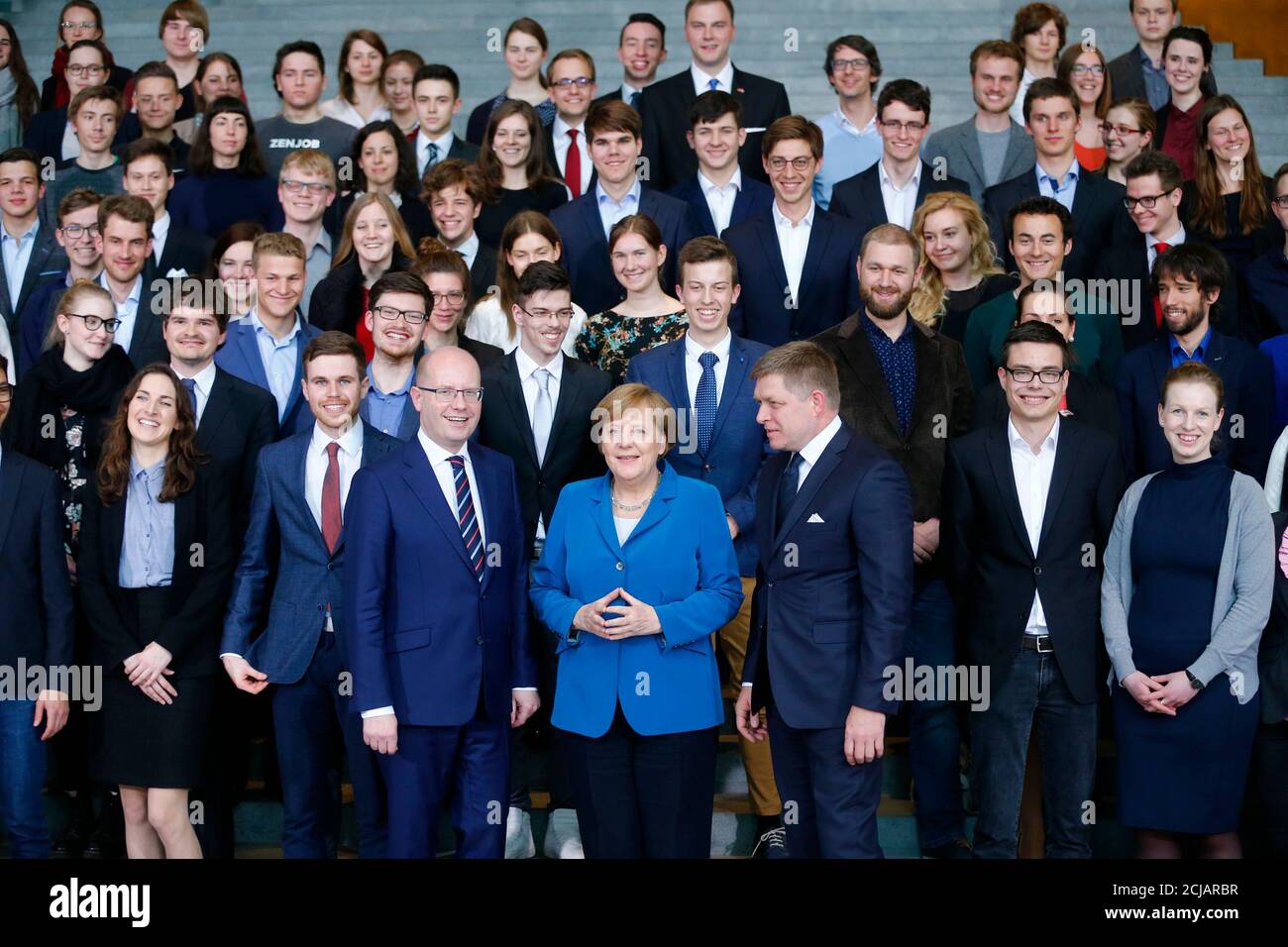 Czech Republic Prime Minister Bohuslav Sobotka (L to R), German Chancellor Angela Merkel and Slovakian Prime Minister Robert Fico pose for a picture with school pupils of all three countries at the Chancellery in Berlin, Germany, April 3, 2017. REUTERS/Hannibal Hanschke Stock Photo