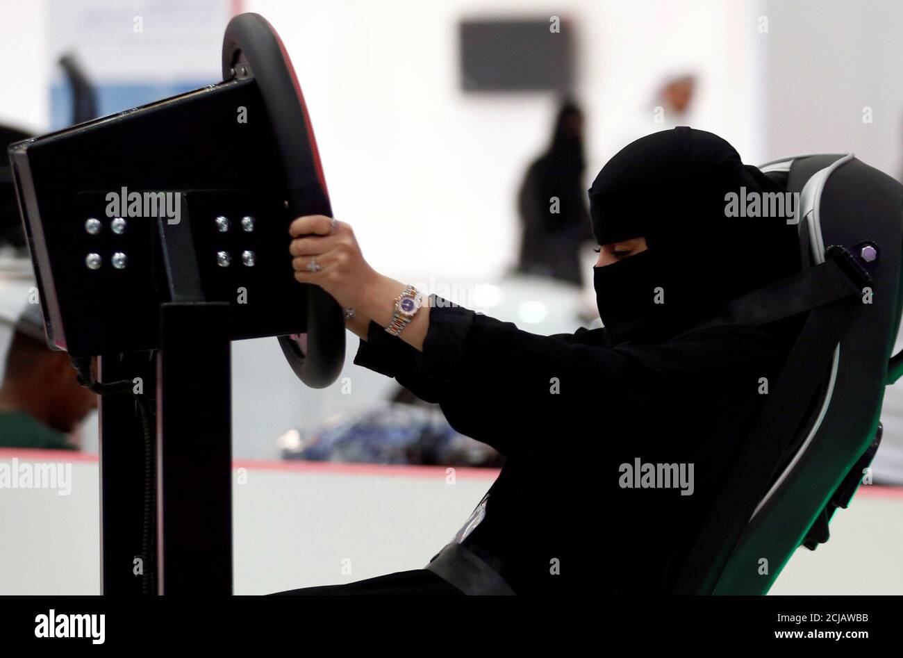 A Saudi woman tries a car simulator during women car show in Riyadh, Saudi Arabia May 13, 2018. REUTERS/Faisal Al Nasser Stock Photo