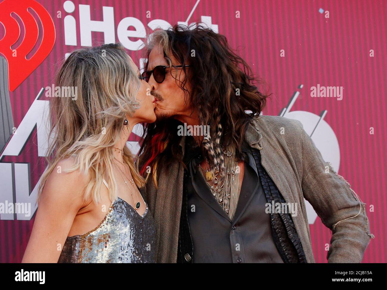 Singer Steven Tyler and Aimee Preston kiss as they arrive for the  iHeartRadio Music Awards in Los Angeles, California, U.S., March 14, 2019.  REUTERS/Mario Anzuoni Stock Photo - Alamy