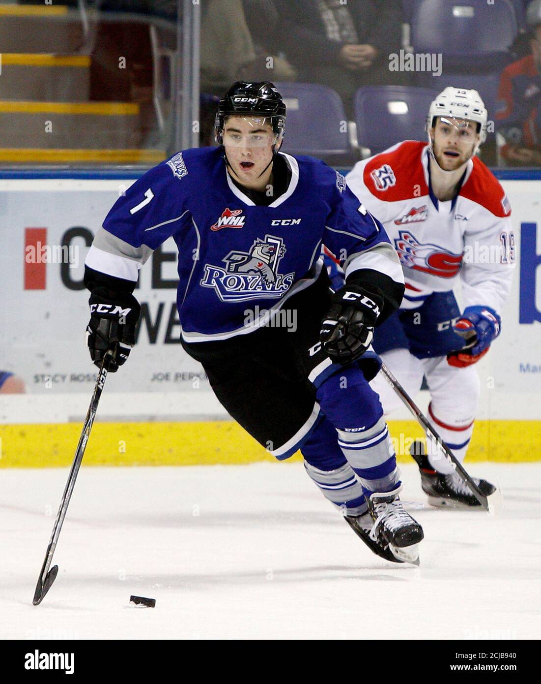 Defenceman Scott Walford of the Western Hockey League team Victoria Royals  passes a Spokane Chiefs player