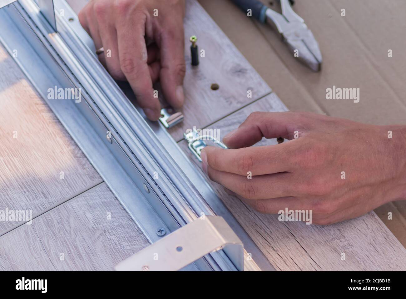 furniture assembling Carpentry joins up the table Stock Photo Alamy