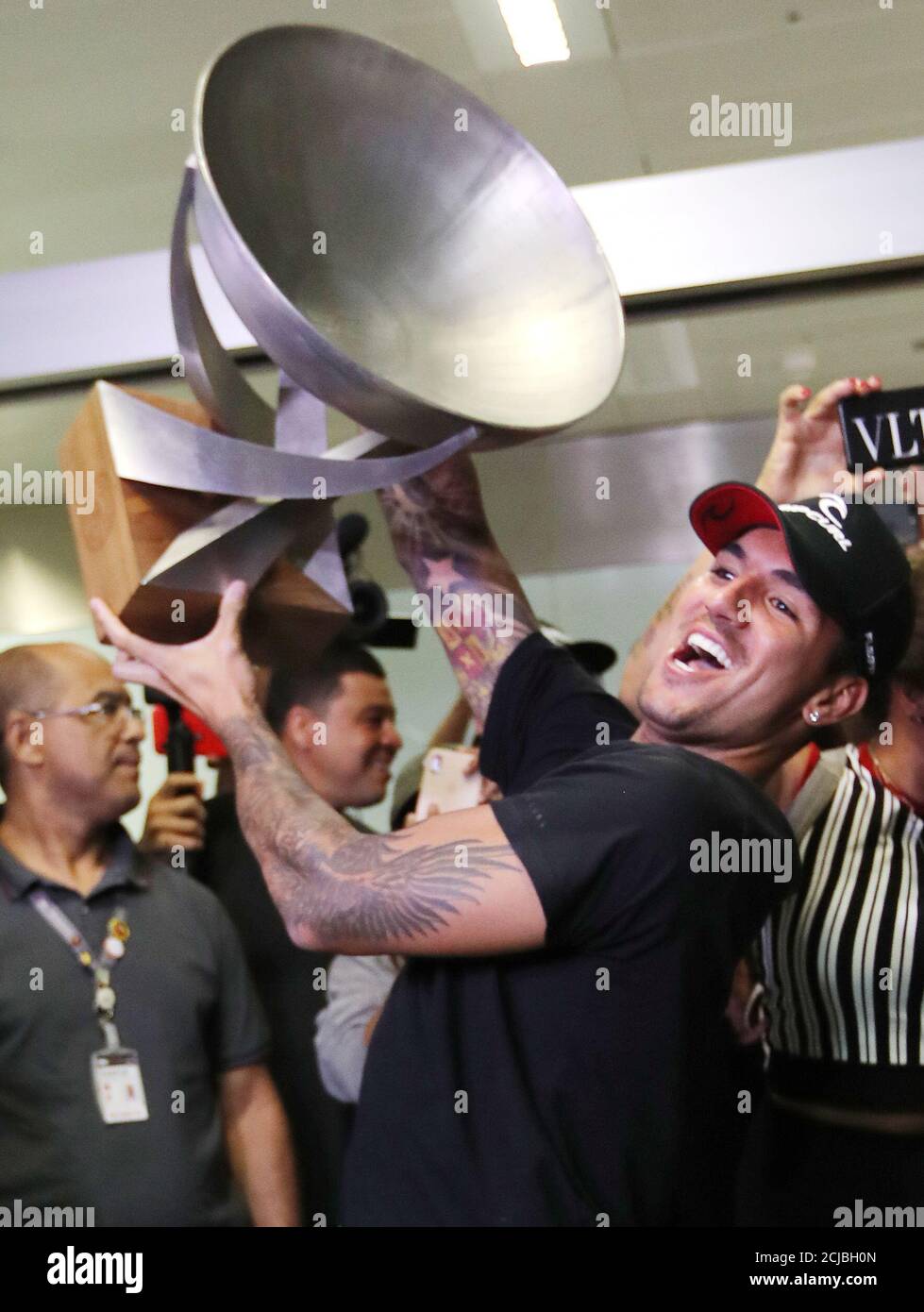 Surfing - Gabriel Medina WSL World Champion arrives in Brazil -  Sao Paulo, Brazil - December 22, 2018    Brazil's Gabriel Medina arrives at the airport and celebrates with the trophy   REUTERS/Paulo Whitaker Stock Photo