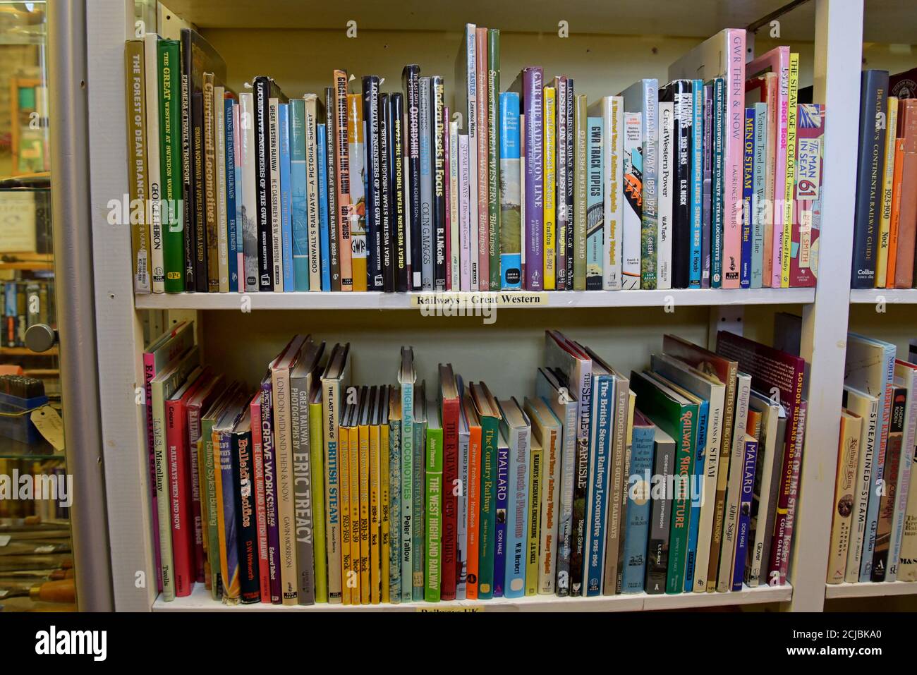A bookshelf full of secondhand books on railways and transport in a  Leominster Antiques Centre Stock Photo