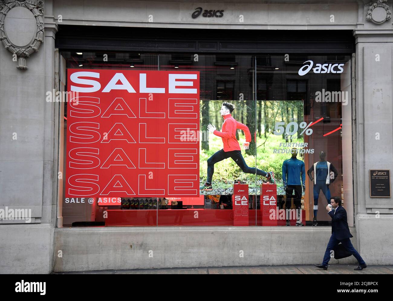 A man walks past an Asics store in London, Britain, January 24, 2020.  REUTERS/Toby Melville Stock Photo - Alamy