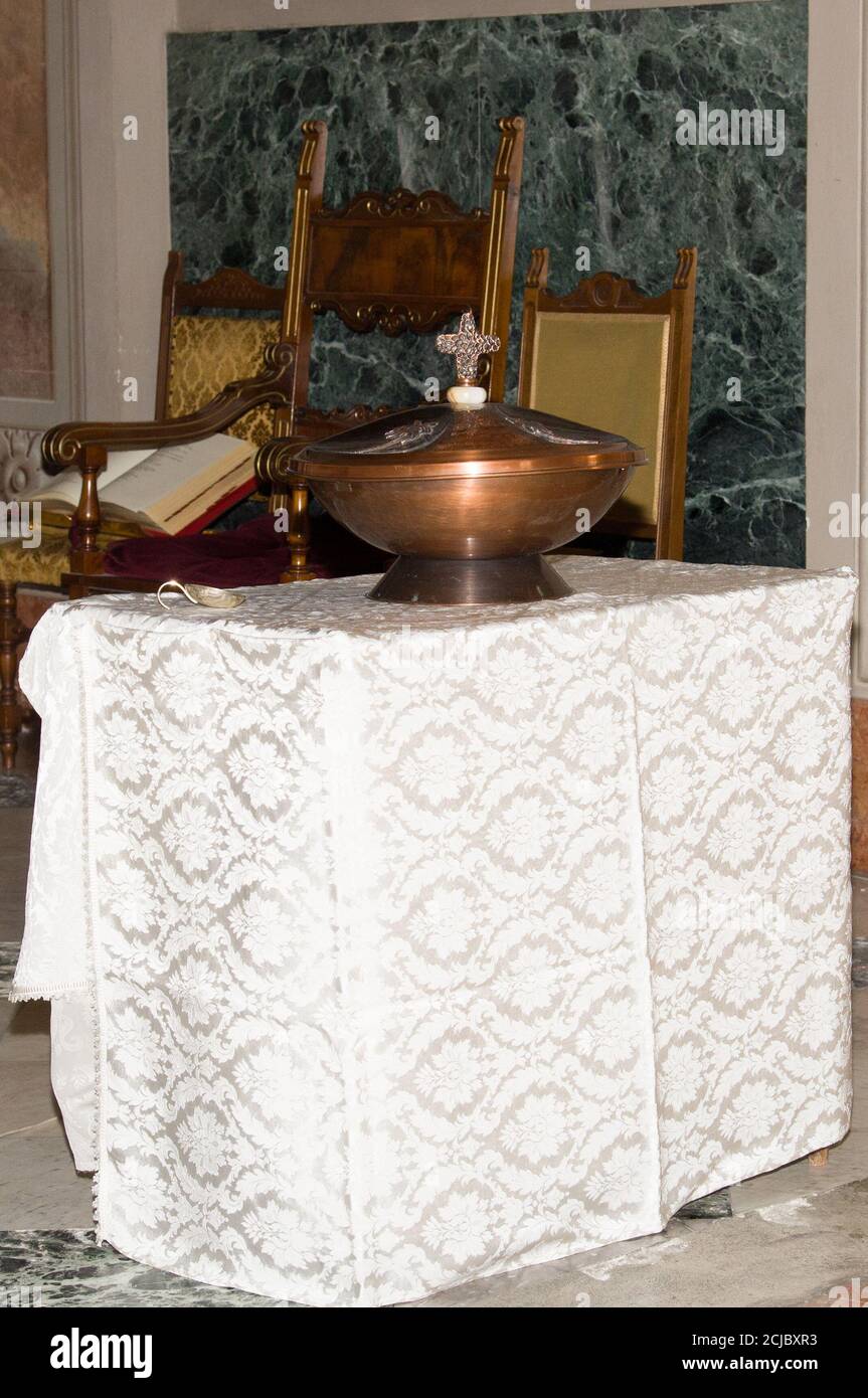 Milan Italy, 12/09/2020 : Catholic church, baptismal font, holy water Stock Photo