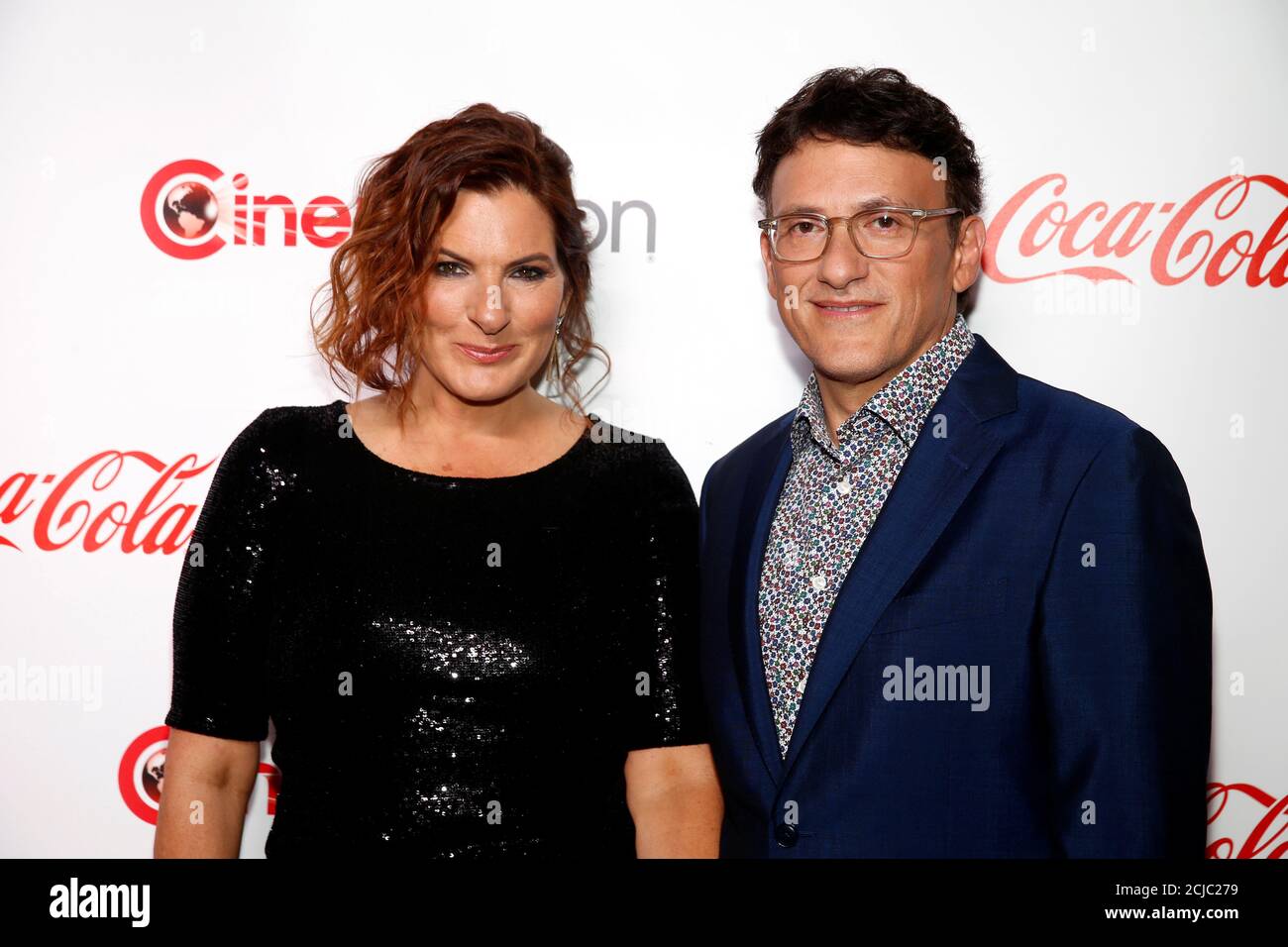 Director Anthony Russo poses with his wife actress Ann Russo during the CinemaCon Big Screen Achievement
