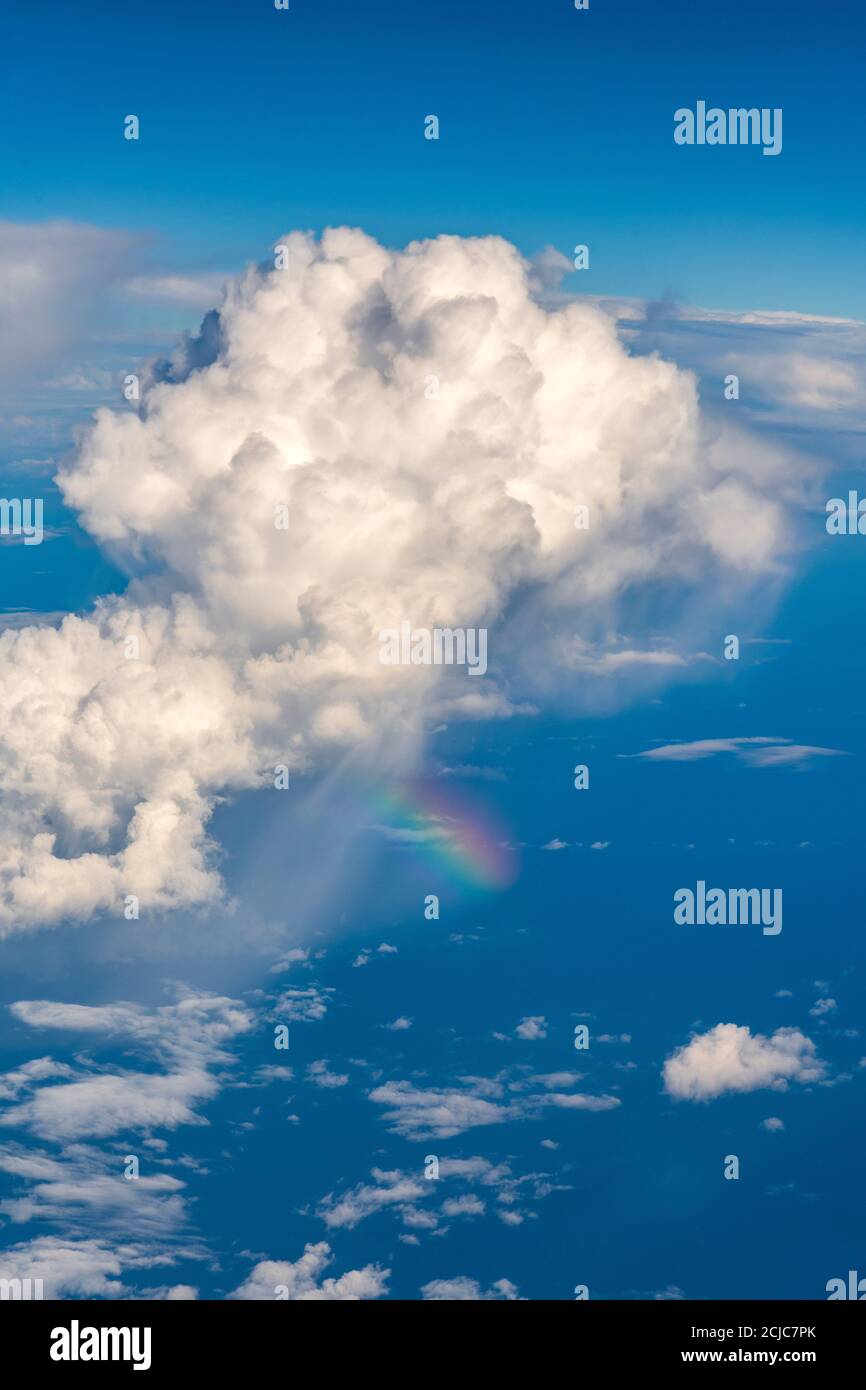 Aerial view of a thunder cloud with a rainbow over the Mediterranean sea near Balearian Islands, Spain Stock Photo