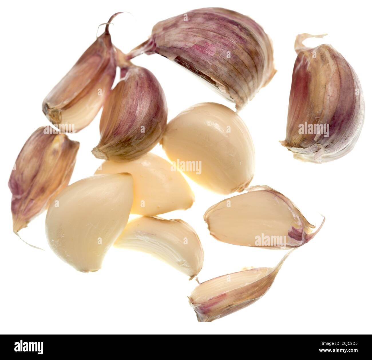 Garlic cloves isolated on white background Stock Photo - Alamy