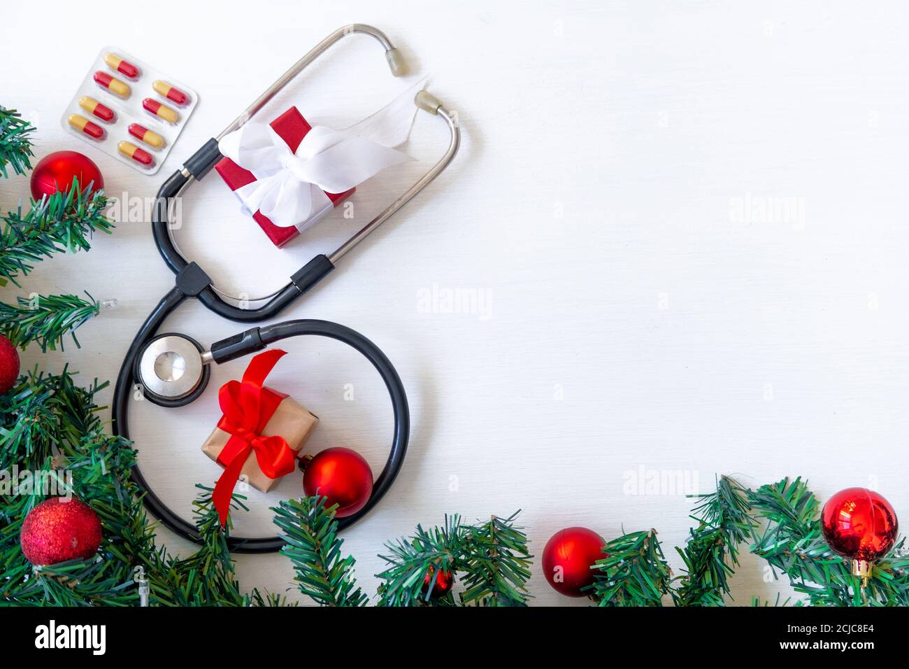 Medical banner with pills, gift present box, stethoscope and Christmas