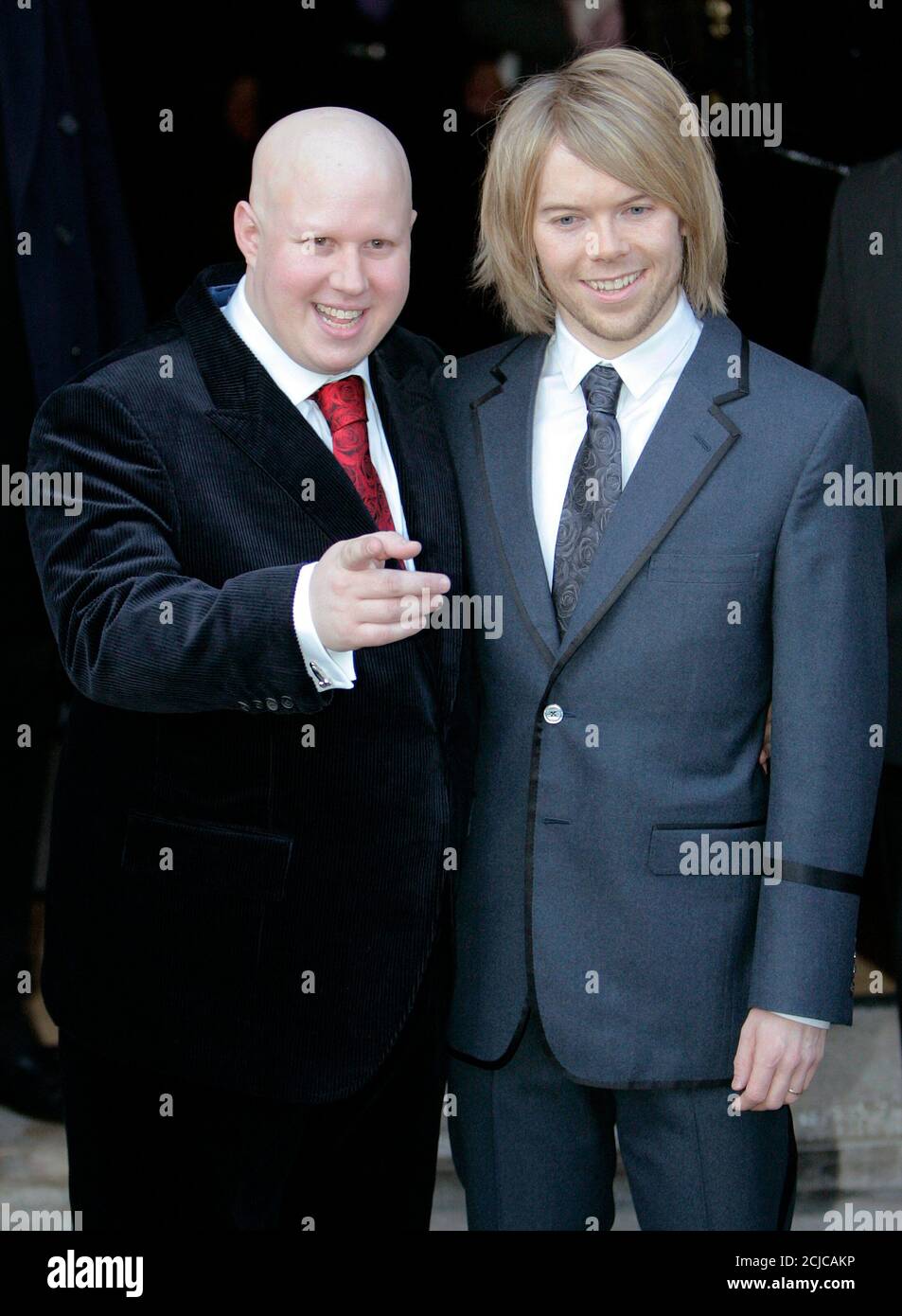 British stand-up comedian Matt Lucas (L) poses for photographers with his  partner Kevin McGee (R) following their civil partnership ceremony in  central London December 17, 2006. REUTERS/Toby Melville (BRITAIN Stock  Photo -