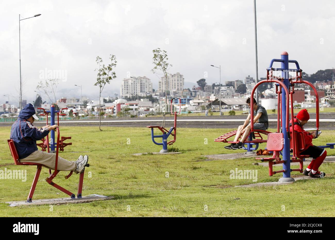 People exercise at the site of the former Quito airport, which was converted into a recreational area named Bicentenario park, in Quito March 6, 2016. REUTERS/Guillermo Granja Stock Photo