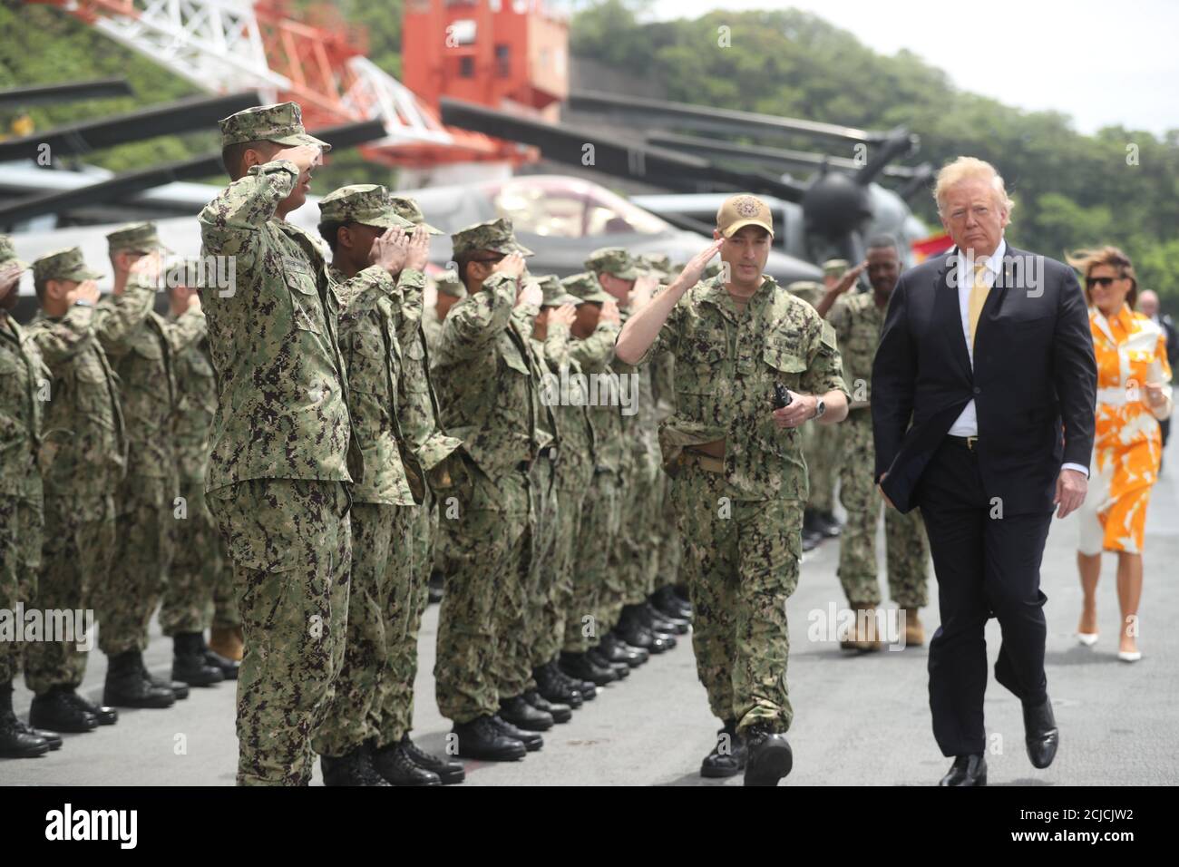 U.S. President Donald Trump walks past troops aboard the USS Wasp (LHD 1) in Yokosuka, south of Tokyo, Japan May 28, 2019.  REUTERS/Jonathan Ernst Stock Photo