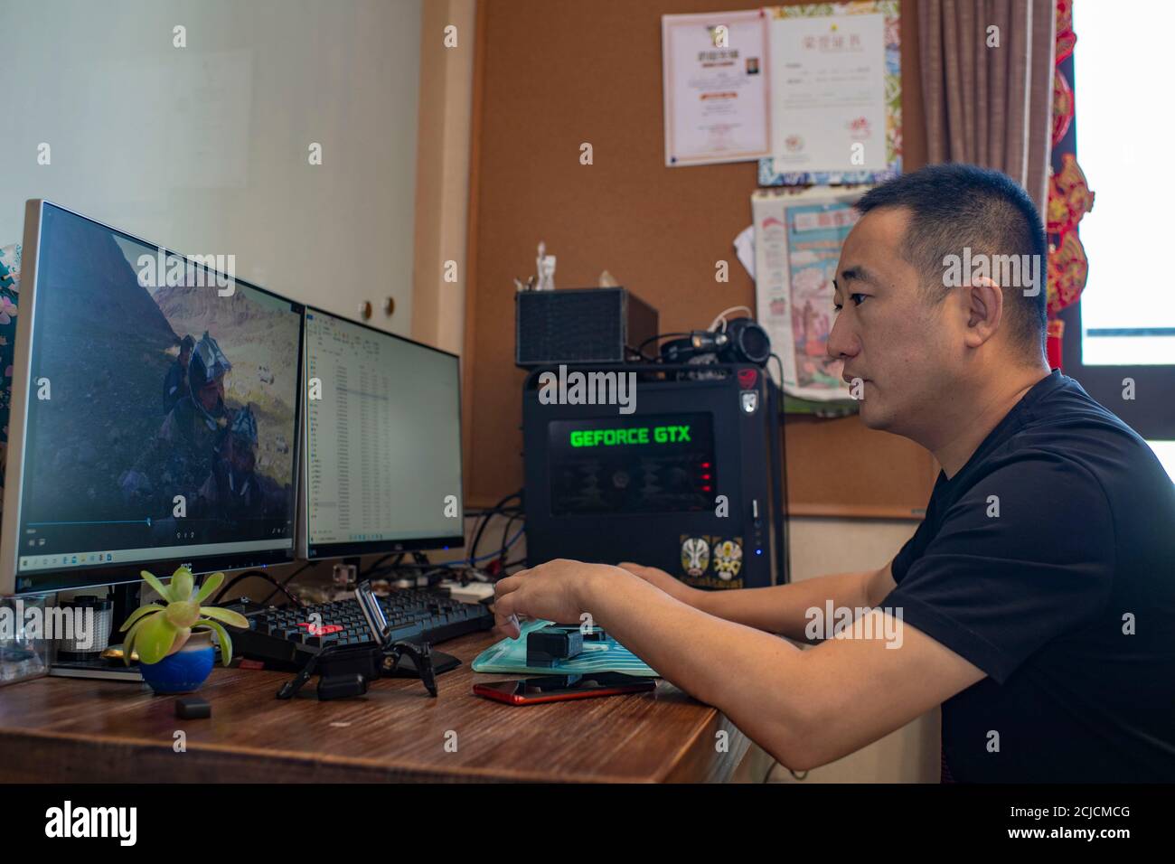 Urumqi. 11th Sep, 2020. Photo taken on Sept. 11, 2020 shows motorcycler Gao Dongxu editing videos that he took during cross-country riding in Urumqi, northwest China's Xinjiang Uygur Autonomous Region. Gao Dongxu, 39 years old, and his friends are cross-country enthusiasts who love to explore new riding routes in the mountains. Credit: Hu Huhu/Xinhua/Alamy Live News Stock Photo