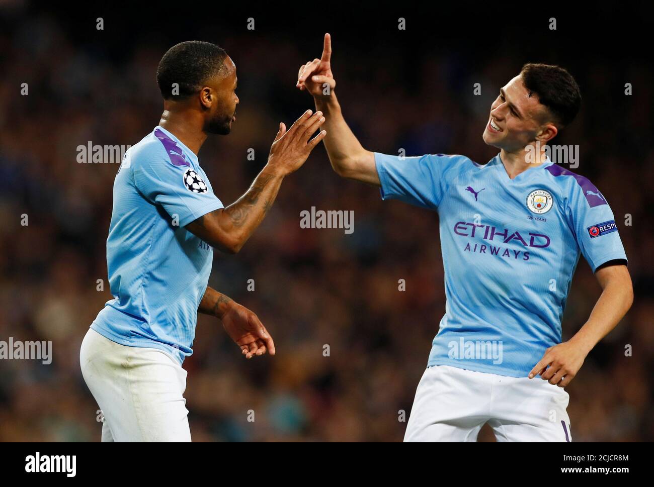 Soccer Football - Champions League - Group C - Manchester City v Atalanta - Etihad Stadium, Manchester, Britain - October 22, 2019  Manchester City's Raheem Sterling celebrates scoring their fourth goal with Phil Foden   Action Images via Reuters/Jason Cairnduff Stock Photo