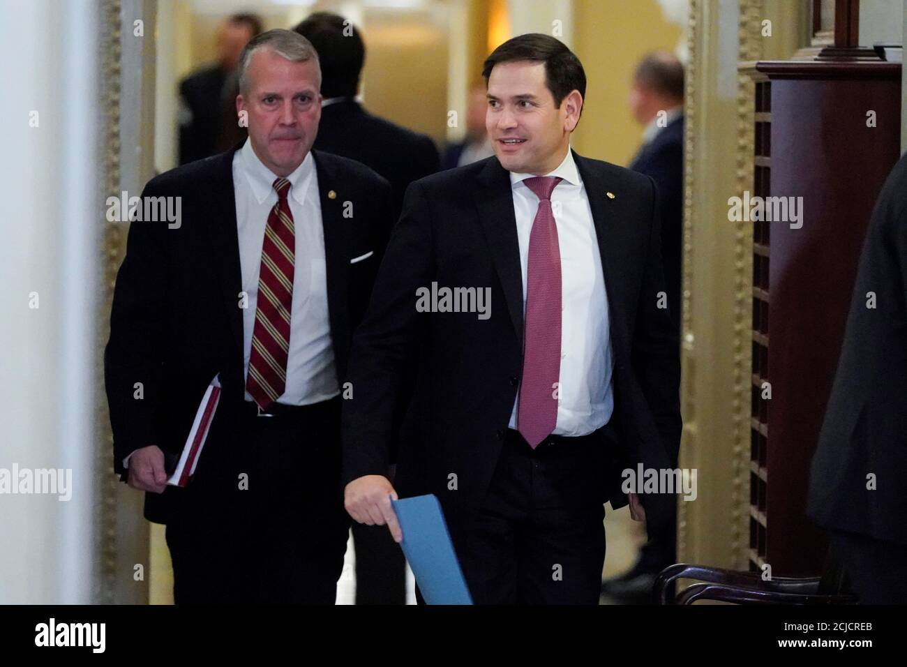 U S Senators Marco Rubio R Fl And Ben Cardin D Md Walk Towards The Senate Chamber Stock Photo Alamy