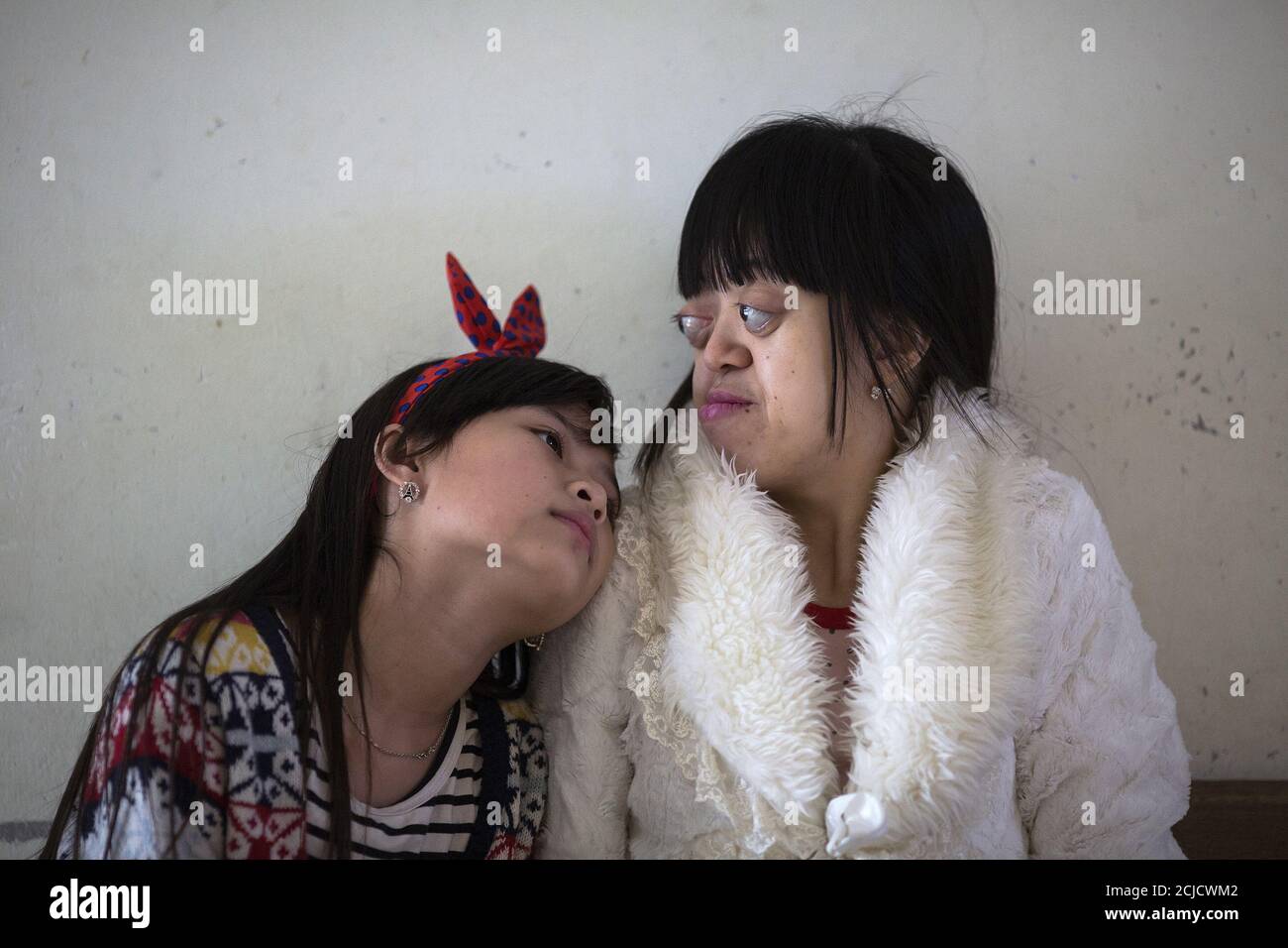 Nguyen Thi Van Long R And Her Best Friend Dinh Thi Huong Who Is Deaf And Mute Spend Time Together At Friendship Village A Hospice For Agent Orange Victims Outside Hanoi April