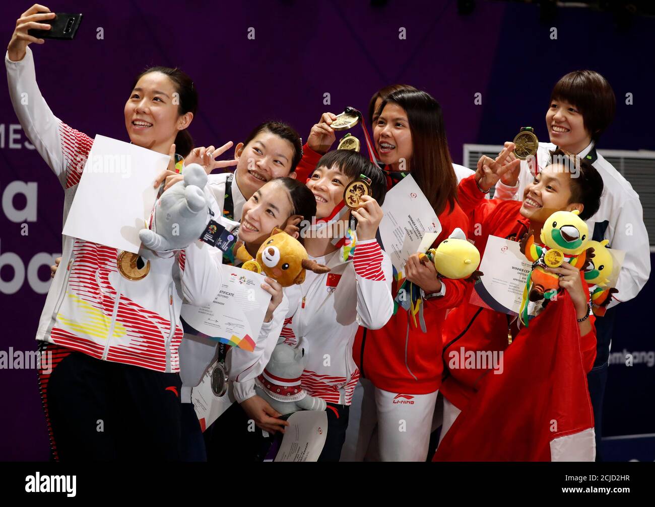 Badminton - 2018 Asian Games - Women's Doubles Medal Ceremony - GBK -  Istora - Jakarta, Indonesia - August 27, 2018 - Gold medalists Chen  Qingchen and Jia Yifan of China, silver