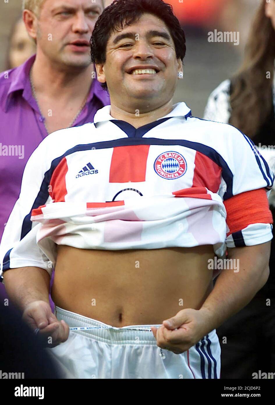Argentinian soccer star Diego Maradona, as team captain of German first  division soccer club Bayern Munich, adjusts his trousers prior to the  farewell soccer match for Lothar Matthaeus between the German national
