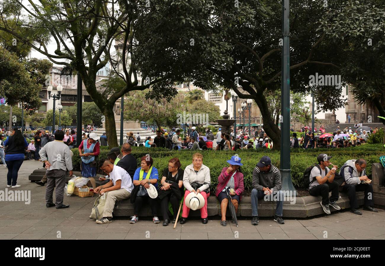 People are seen gathered at the main square in Quito, Ecuador March 30, 2017. REUTERS/Mariana Bazo Stock Photo