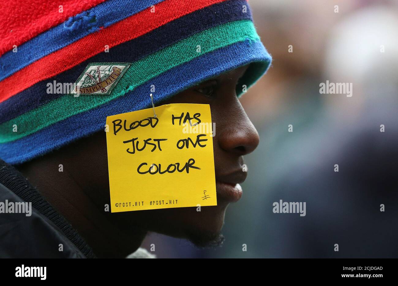 A man attends a rally against racism and in support of Idy Diene, a Senegalese street vendor who was killed by an Italian, in Florence, Italy March 10, 2018. REUTERS/Alessandro Bianchi Stock Photo