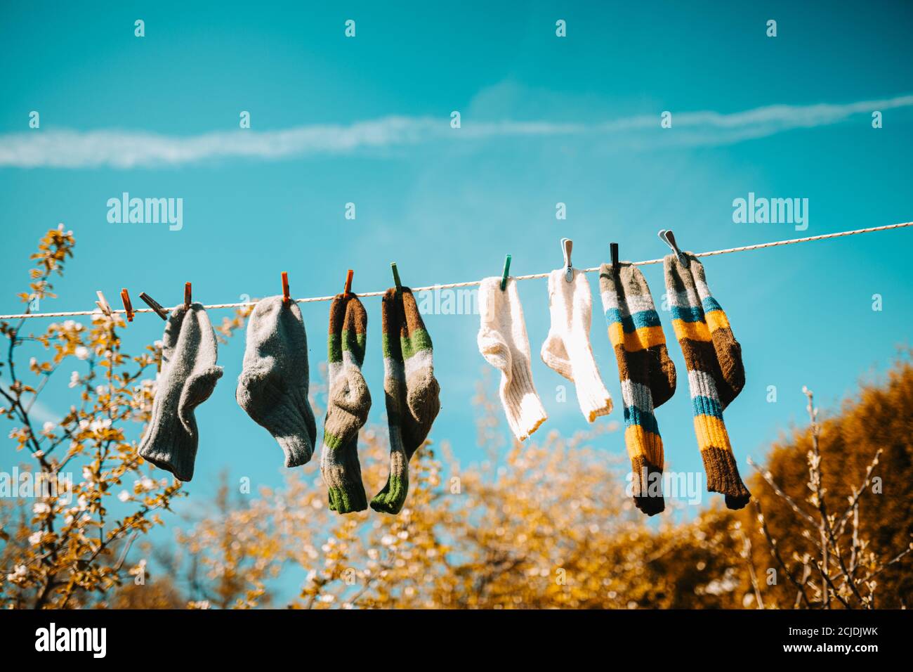 Low angle shot of socks hang on rope grafted with a clothespin Stock ...