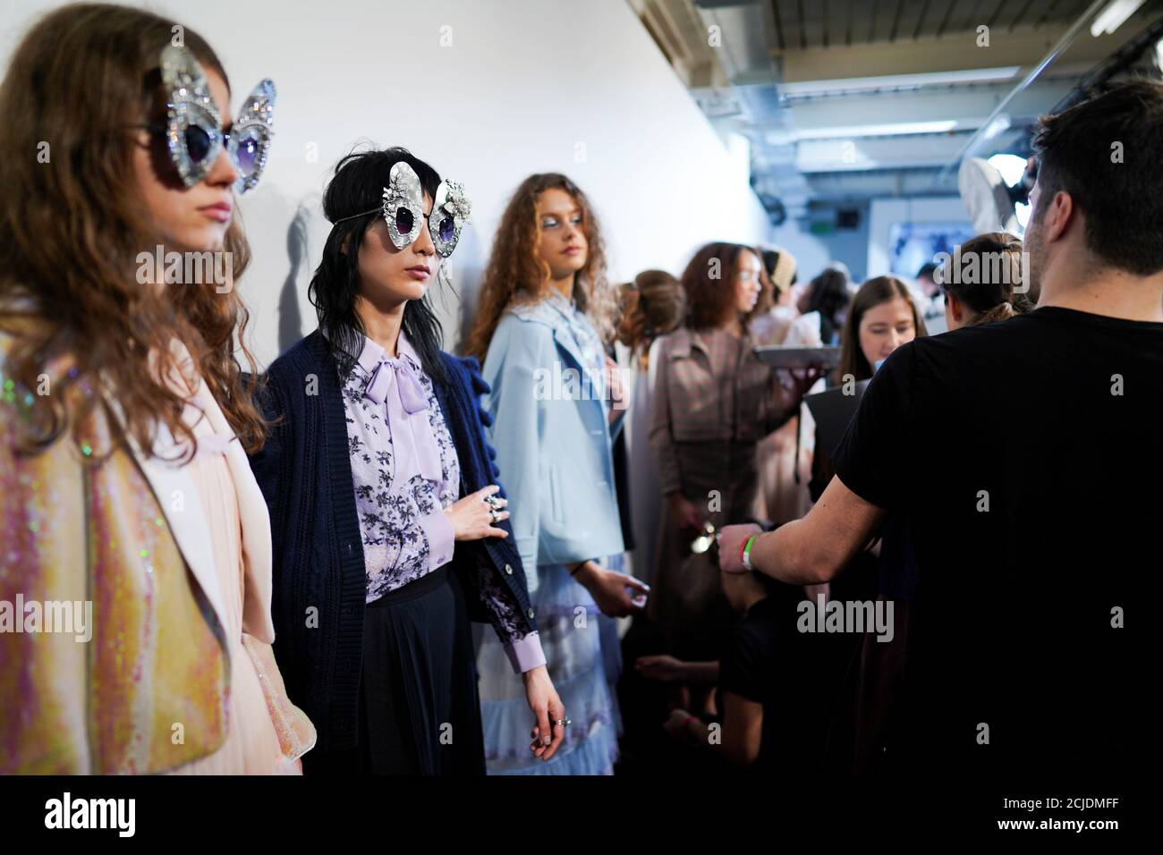 Models prepare backstage of the Bora Aksu show at London Fashion Week Women's A/W19 in London, Britain February 15, 2019. REUTERS/Henry Nicholls Stock Photo