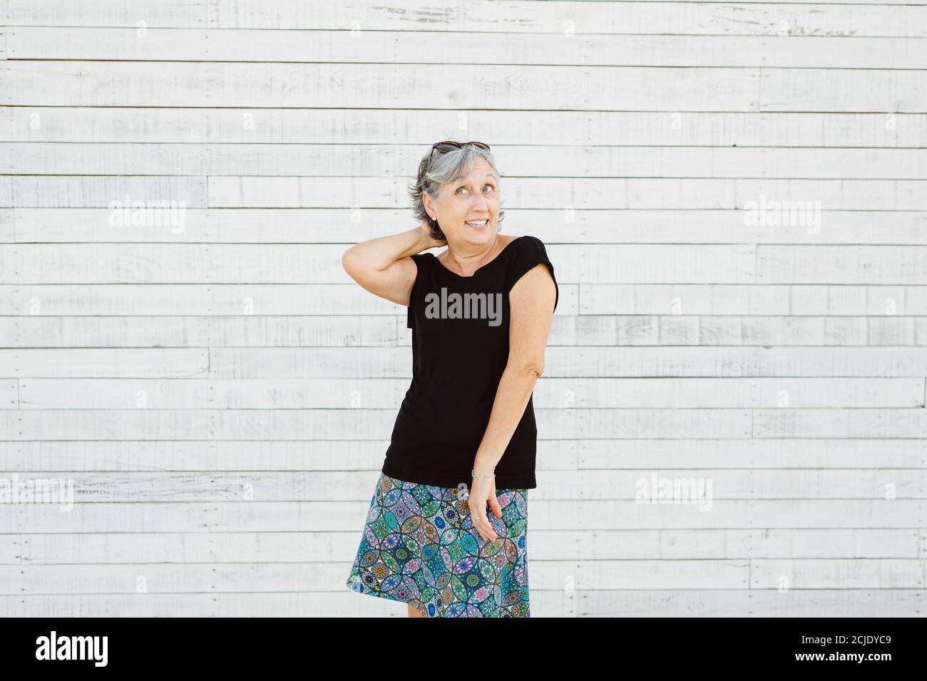 Senior woman making grimace over a white background Stock Photo