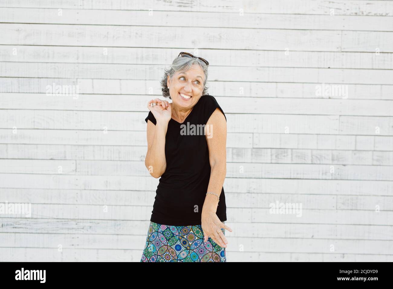 Senior woman making grimace over a white background Stock Photo
