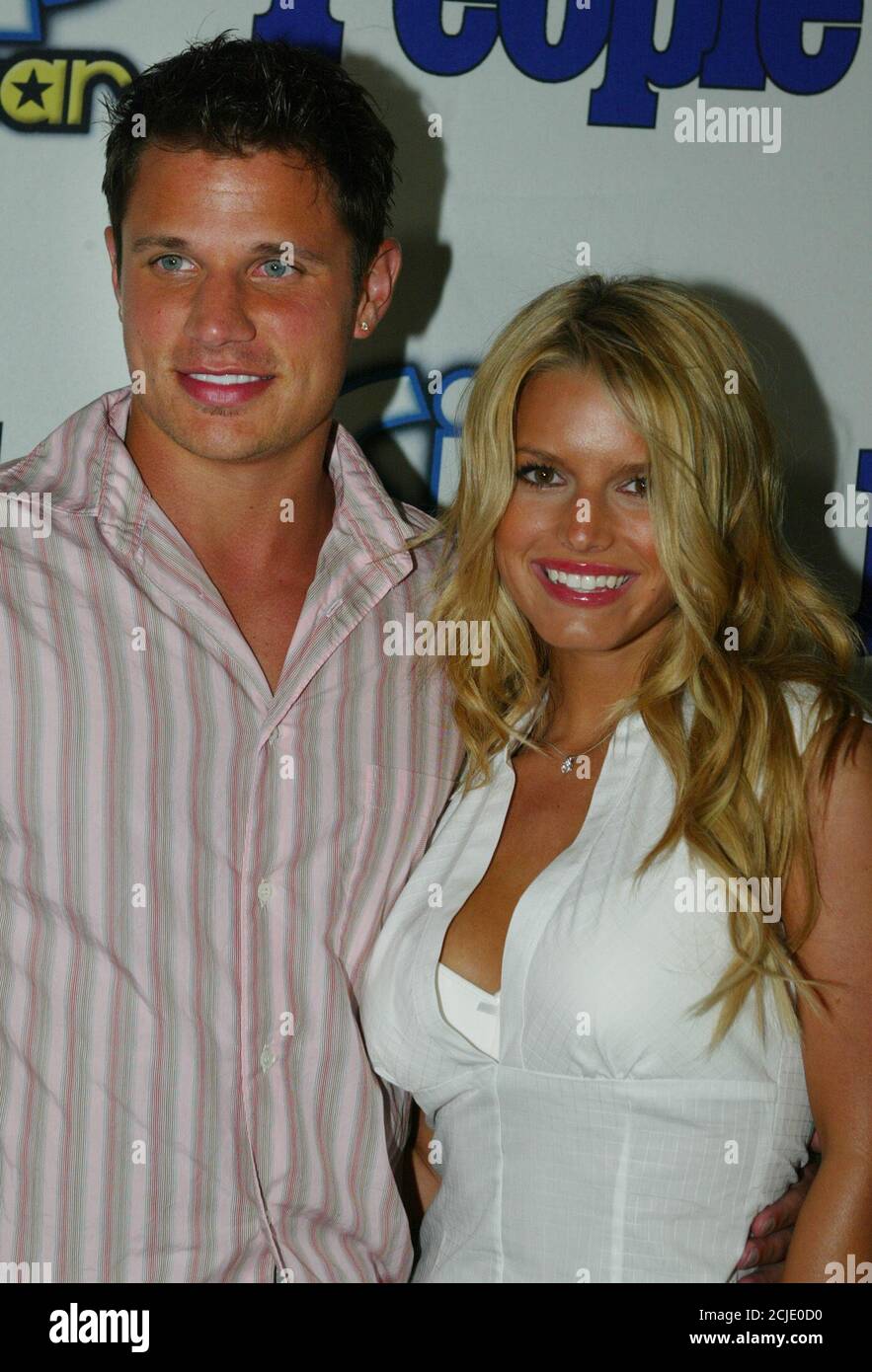 Singer Jessica Simpson And Husband Singer Nick Lachey Pose As They Arrive As Guests At The Sixth Annual Teen People 25 Hottest Stars Under 25 Party In Hollywood May 5 2003 The