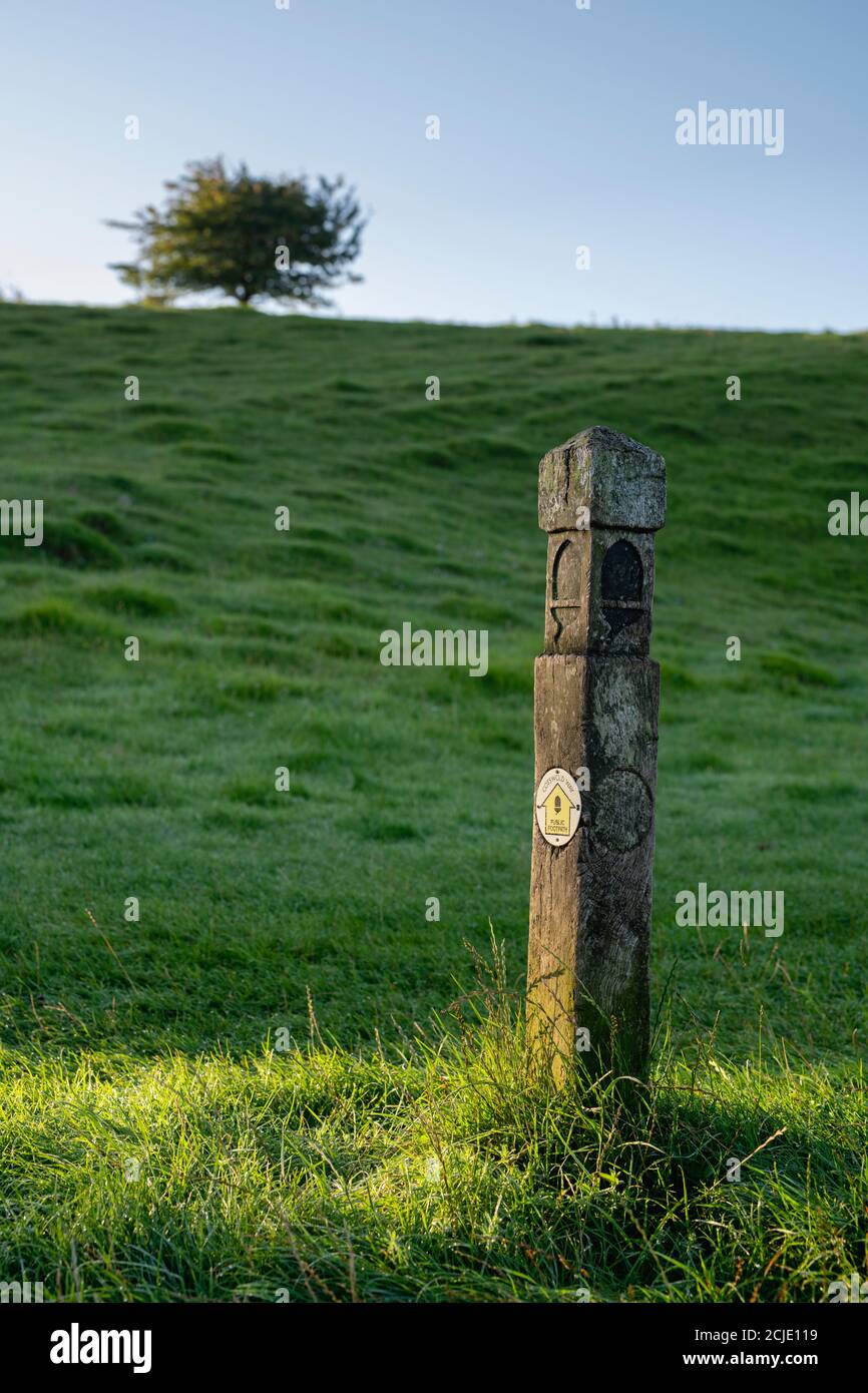 Cotswold Way signpost in the early morning sunlight along the cotswold