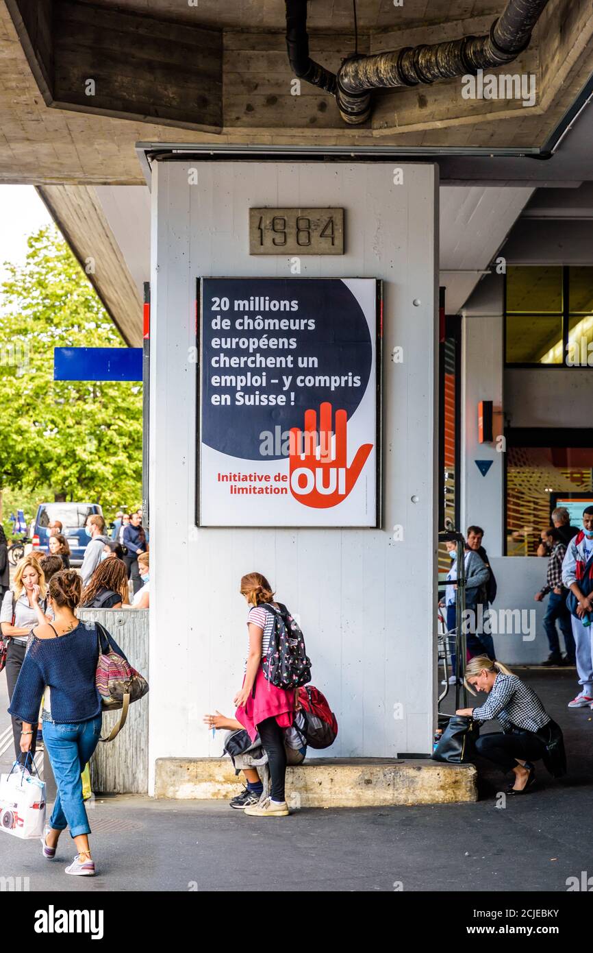 A referendum poster for the September 20th, 2020 immigration vote is displayed on a pillar of the Cornavin train station in Geneva, Switzerland. Stock Photo