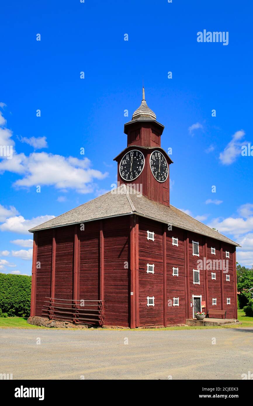 Historic grain storehouse made of logs with baroque steeple and clock with one hand, Jokioinen Manor, Finland. 1800s. Stock Photo
