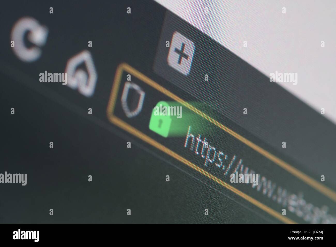 Dark web browser close-up on LCD screen with shallow focus, light shining through https padlock. Internet security, SSL certificate, cybersecurity, se Stock Photo