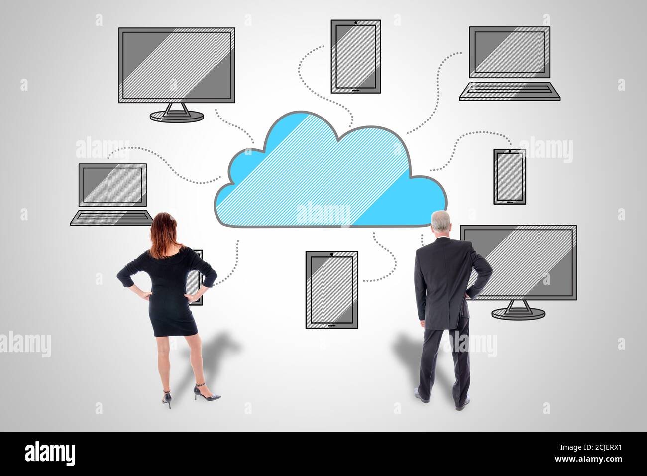 Cloud computing concept drawn on a wall watched by business people Stock Photo