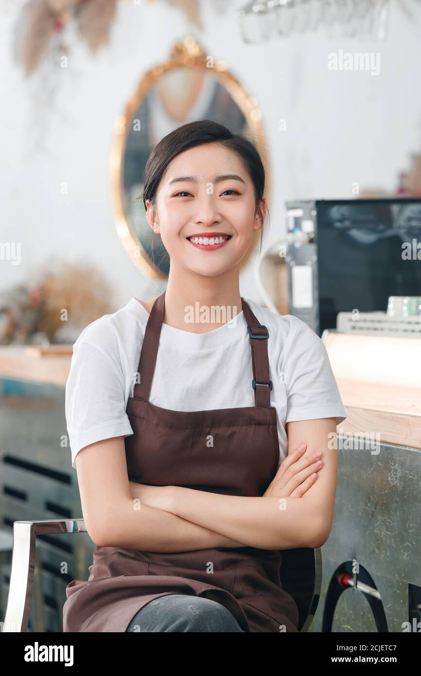 Sit and rest of the coffee shop attendant Stock Photo