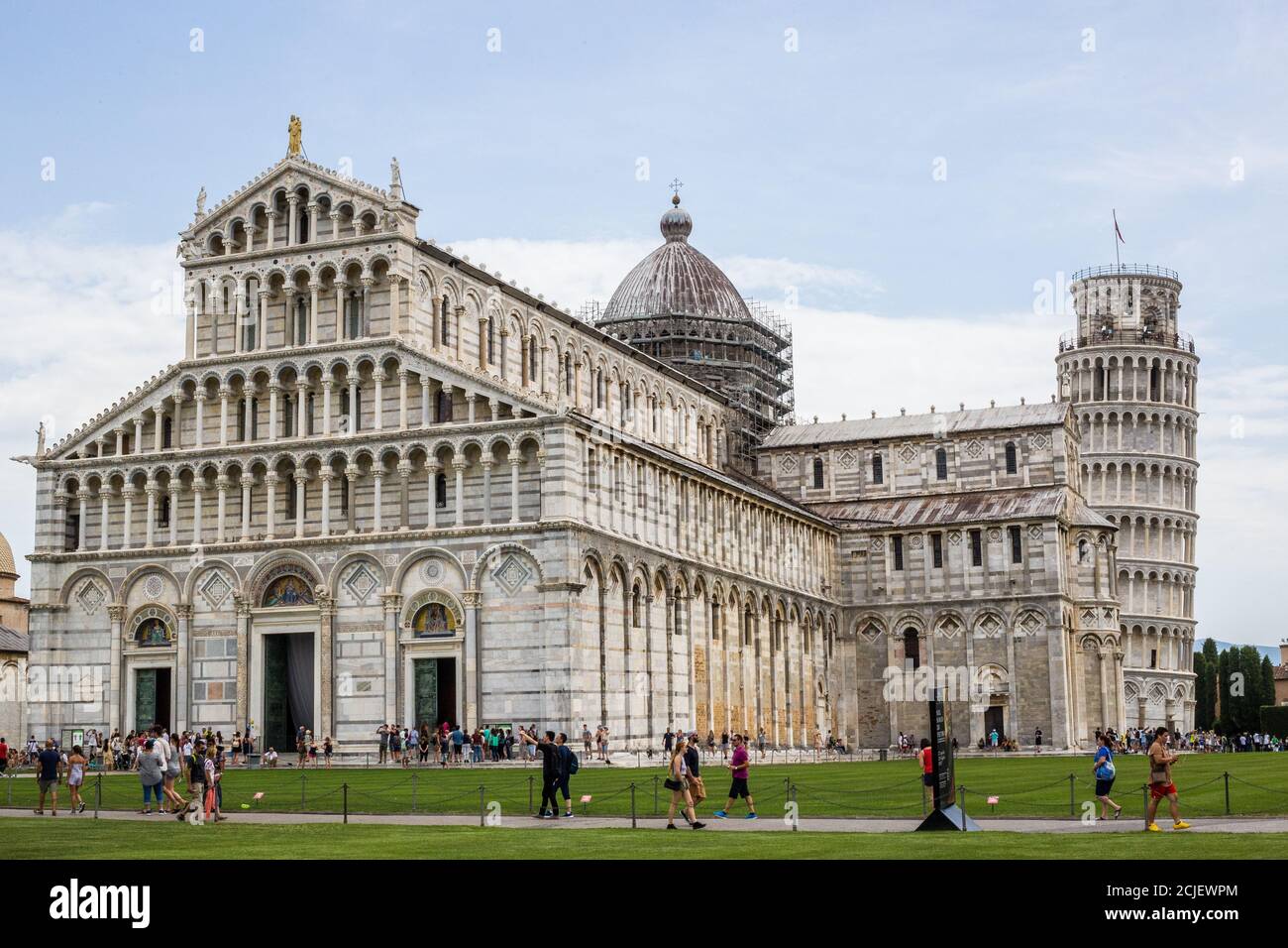 Pisa, Italy - July 9, 2017: View of Tourists, Pisa Cathedral and Leaning Tower in Piazza dei Miracoli Stock Photo
