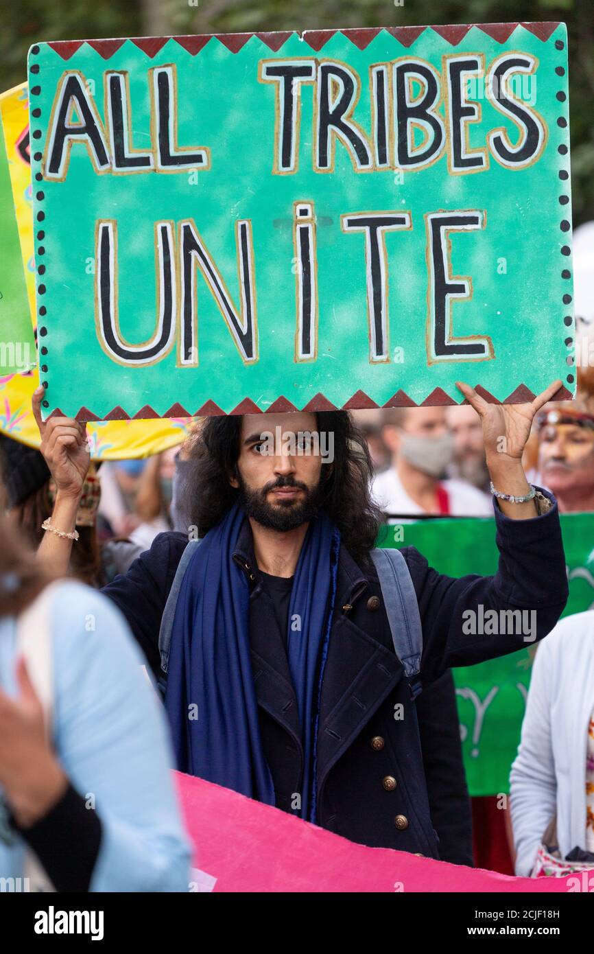 Protester holding placard during 'Rebels for Amazonia' Extinction Rebellion march on Indigenous Womens Day, London, 5 September 2020 Stock Photo