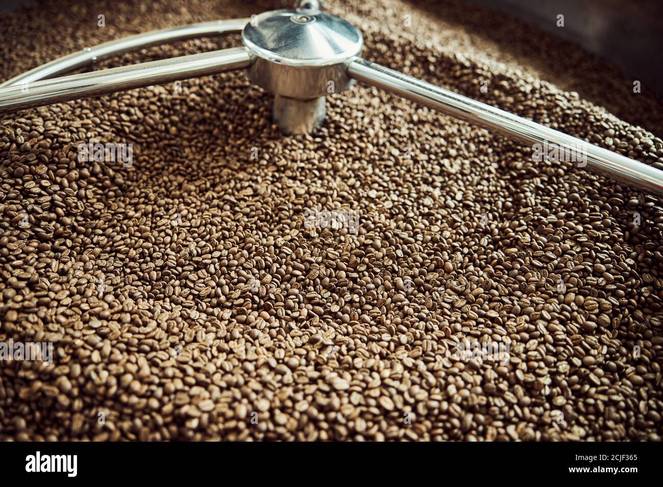 Freshly roasted coffee beans in cooling tray Stock Photo