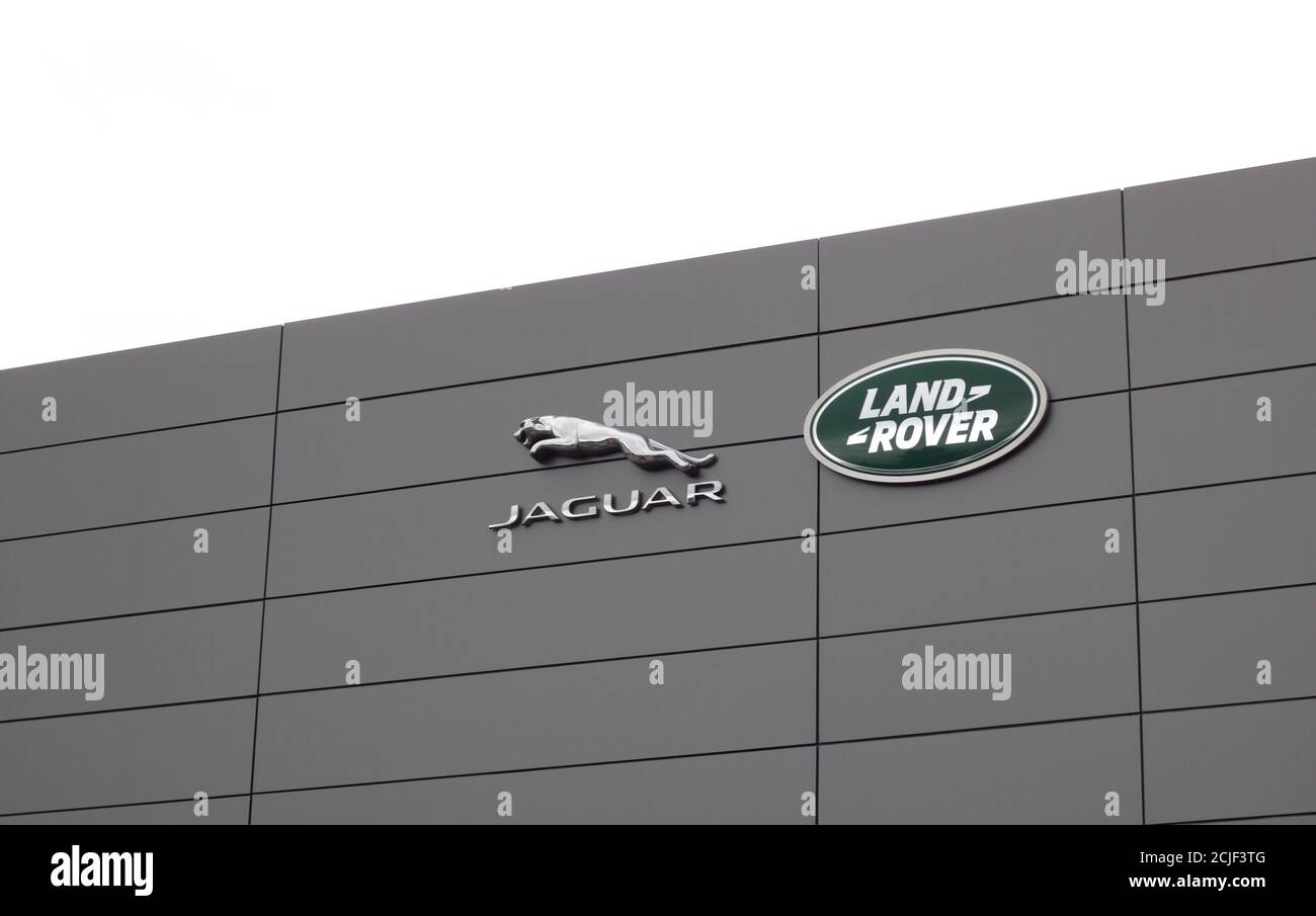 27 June 2020 - UK: Logos of Jaguar and Land Rover on building Stock Photo