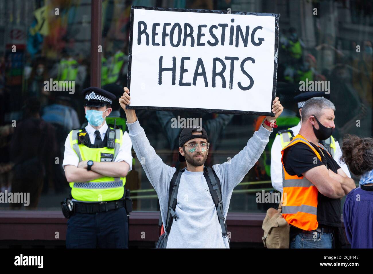 Protester holding placard, 'Rebels for Amazonia' Extinction Rebellion march on Indigenous Womens Day, London, 5 September 2020 Stock Photo