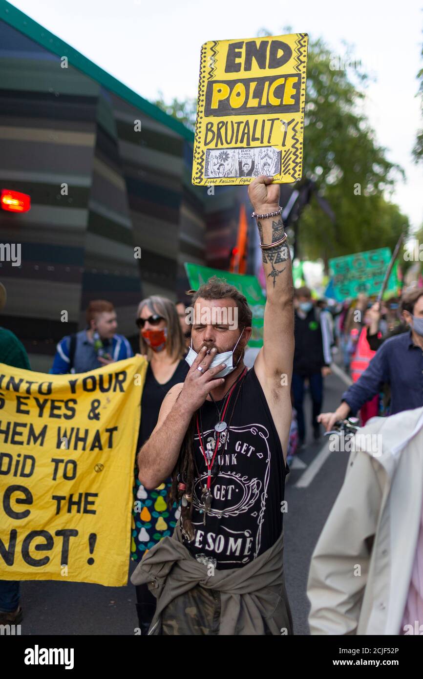 Protester holding placard, 'Rebels for Amazonia' Extinction Rebellion march on Indigenous Womens Day, London, 5 September 2020 Stock Photo
