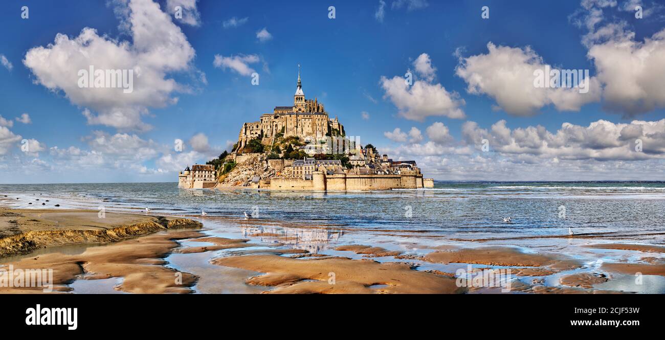 Scenic view of the tidal island  of Mont Saint Michel at high tide surrounded and its medieval abbey of Saint Michel. Normandy France.  The tides vary Stock Photo