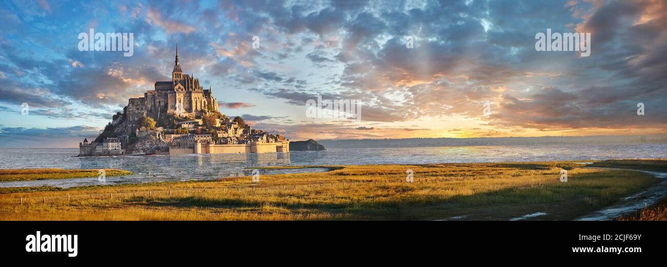 Scenic view of the tidal island  of Mont Saint Michel at high tide surrounded and its medieval abbey of Saint Michel. Normandy France.  The tides vary Stock Photo