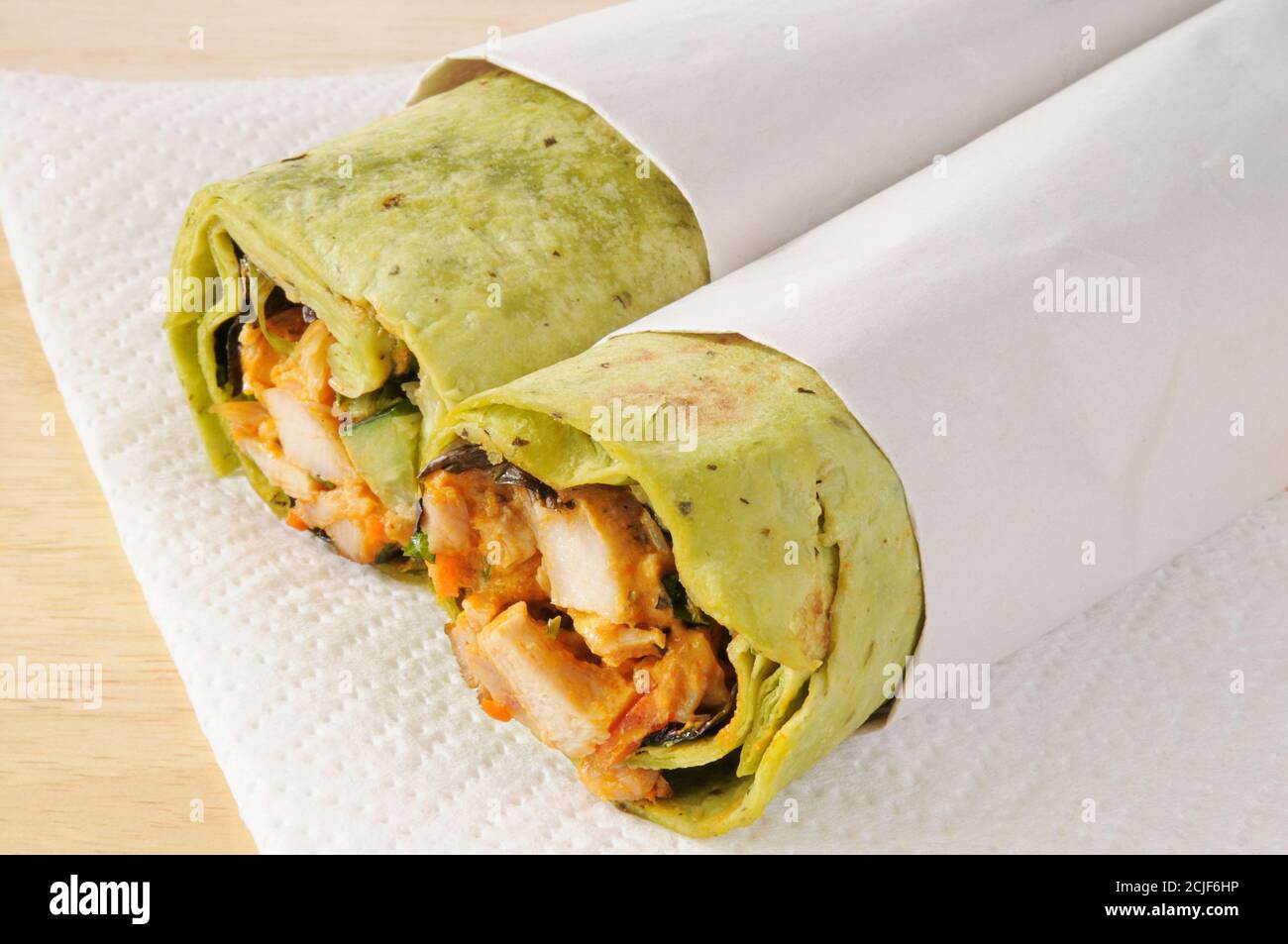 Chicken wrap sandwiches in paper sleeves Stock Photo Alamy
