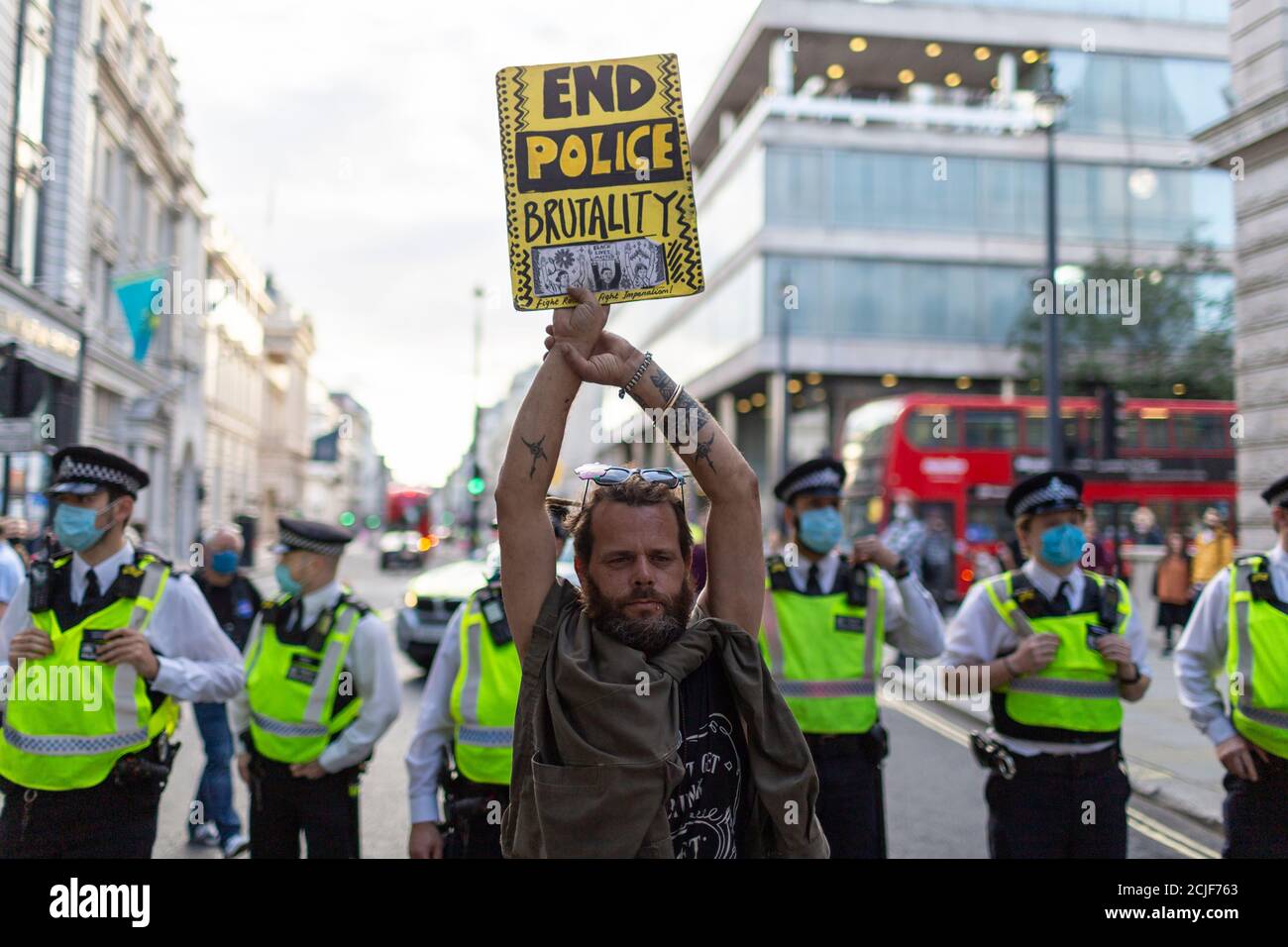 Protester holding up placard, 'Rebels for Amazonia' Extinction Rebellion march on Indigenous Womens Day, London, 5 September 2020 Stock Photo