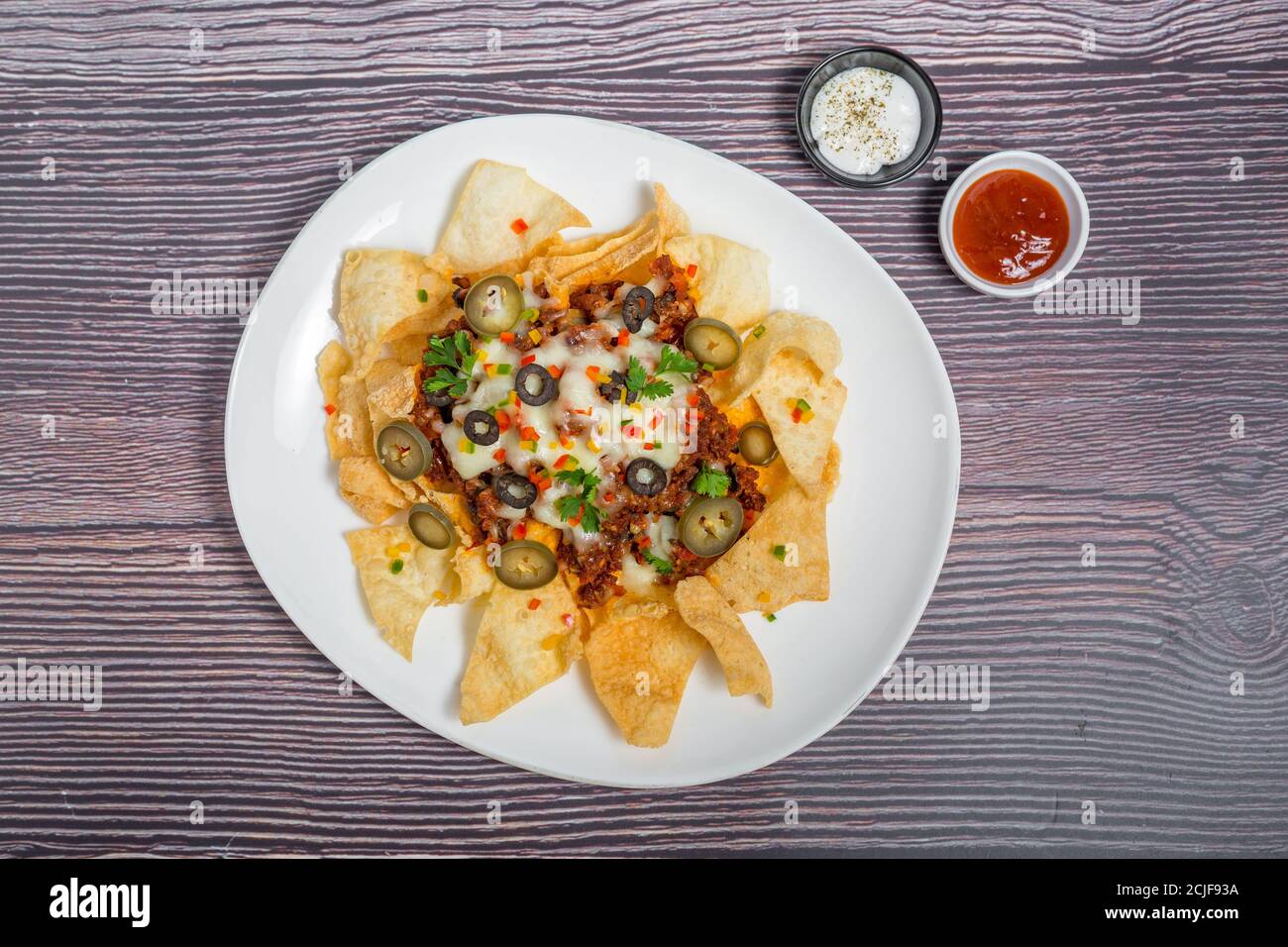 Mexican Famous Food Spicy Ground Beef Nachos. Heated crunchy tortilla