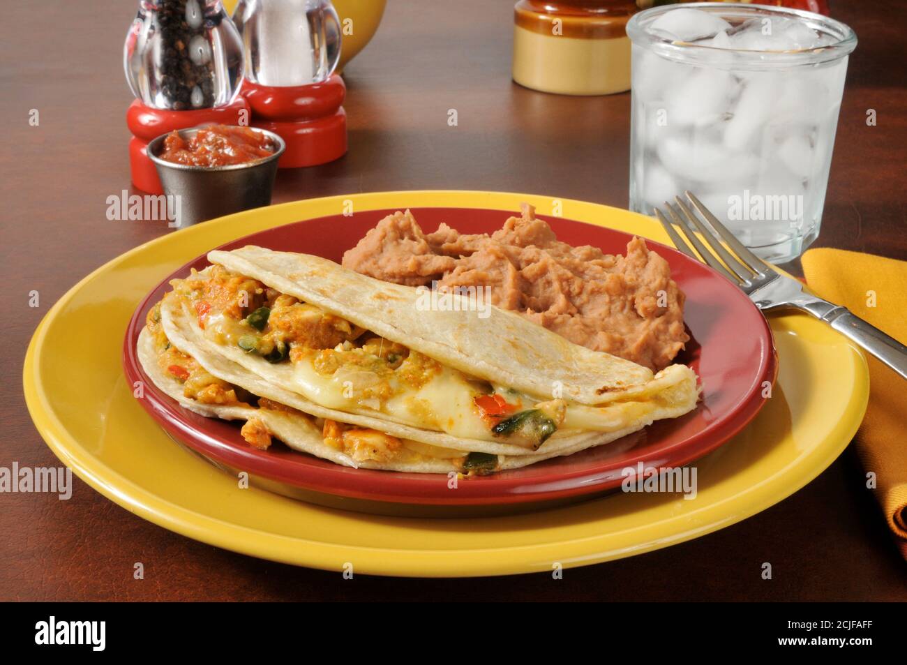 Chicken and cheese quesadillas with refried beans Stock Photo Alamy
