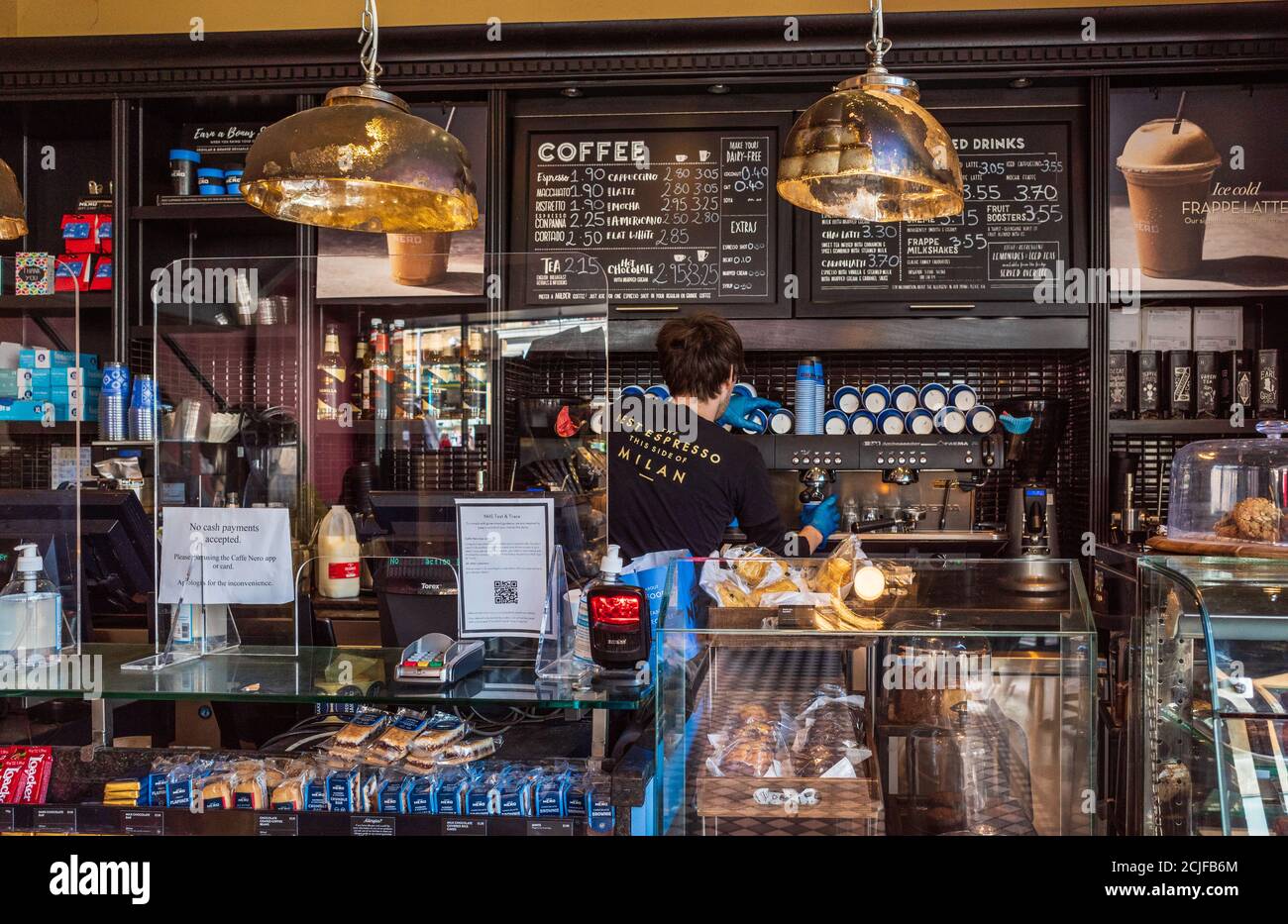 Caffe Nero Coffee Shop Barista - caffe Nero Interior - a Barista prepares coffee at the Caffe Nero Coffee Bar in Cambridge UK. Cafe Nero. Stock Photo