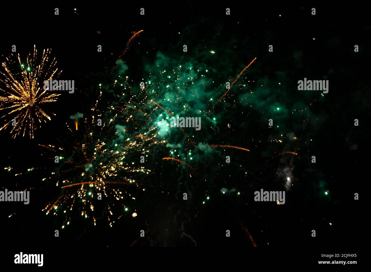 Bright spots of fireworks and colored smoke on a black background Stock Photo - Alamy